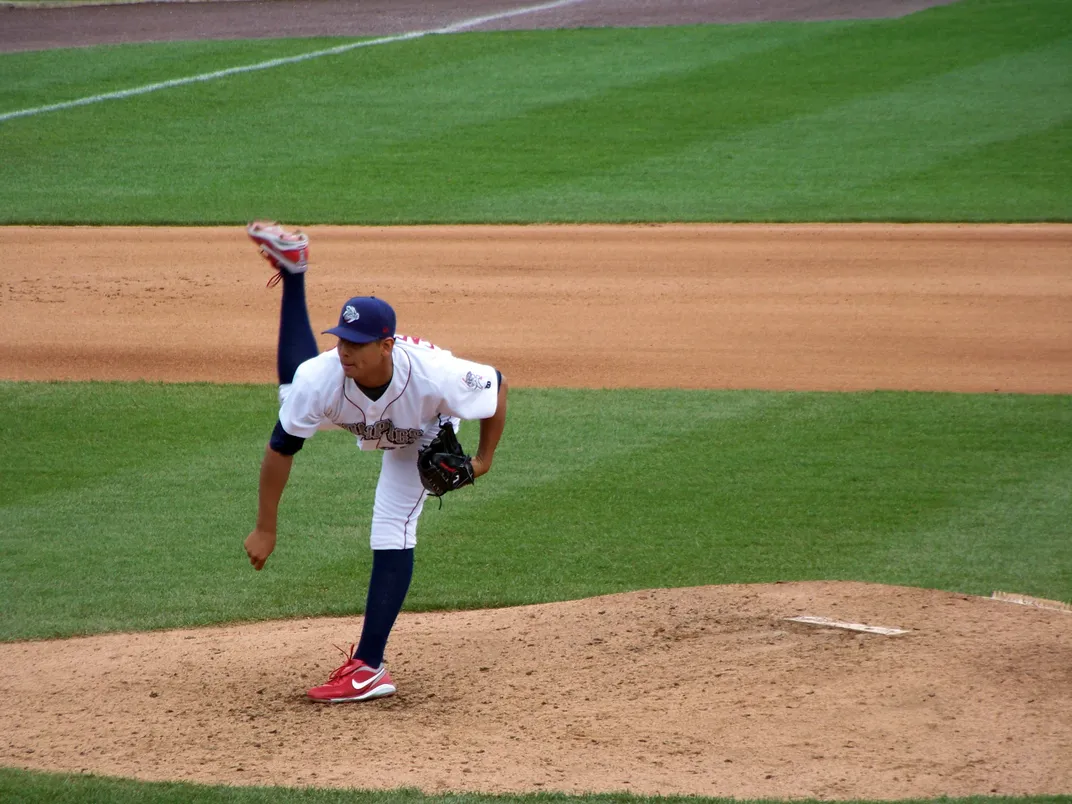 a baseball pitcher throws the ball