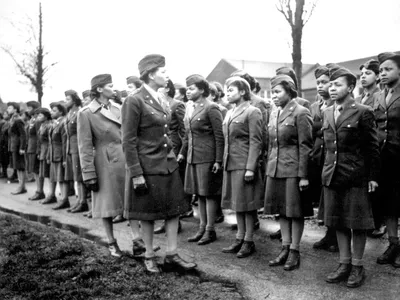The 6888th Central Postal Directory Battalion stands at attention during an inspection in England in 1945.