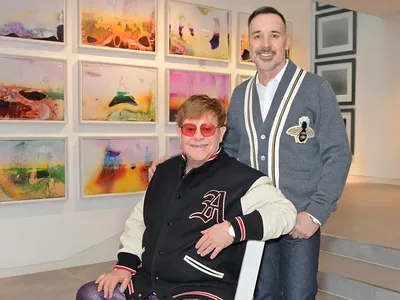Elton John and David Furnish pictured at home in their art gallery in Windsor, England, in 2019