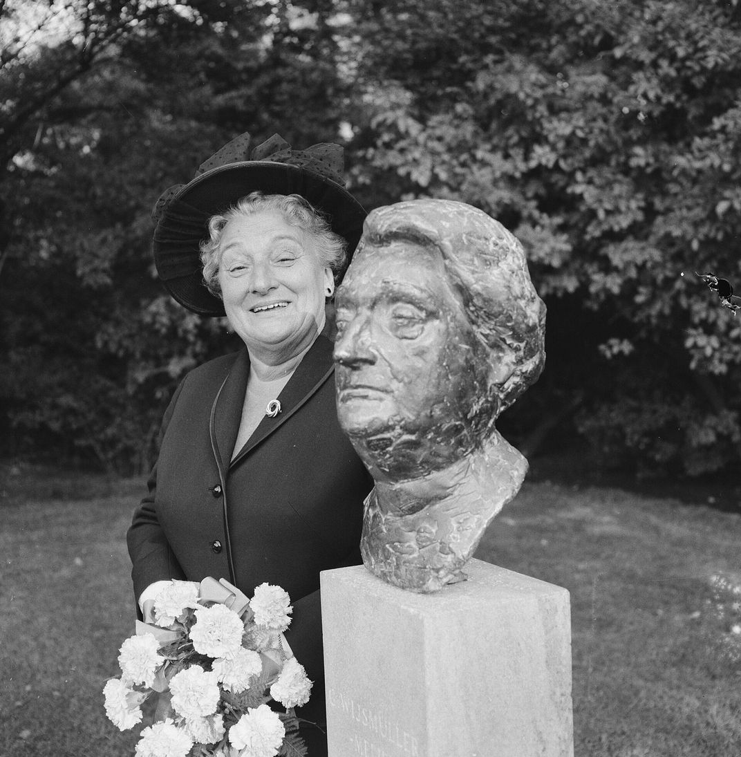 Wijsmuller poses next to a statue of herself in 1965.