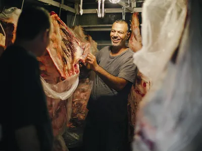 Butcher shop owner Sajad Saleh sells his wares at the Al Tayebat Meat Market. 